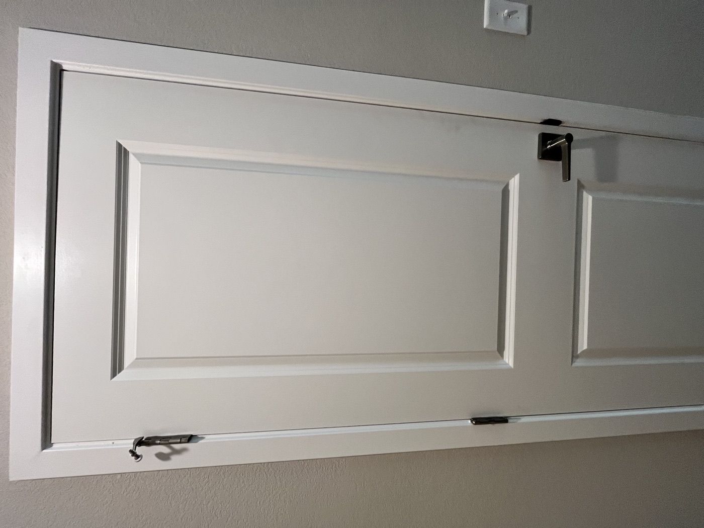 Interior door before repainting, plain white finish